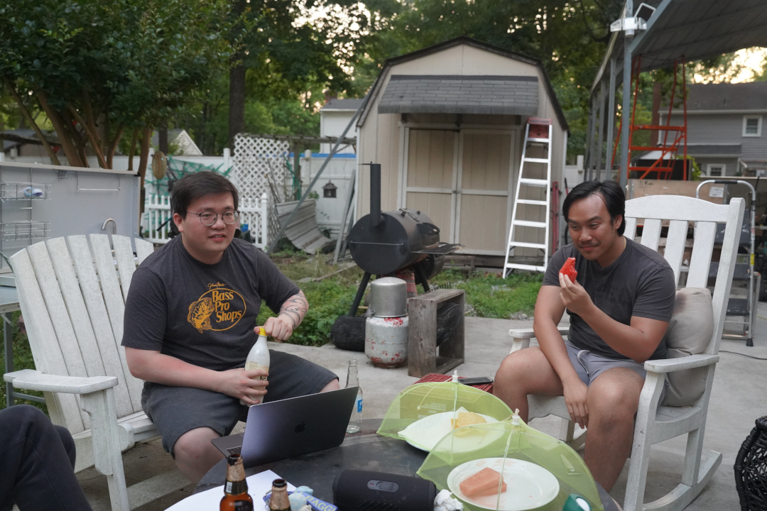 Kevin and Uddom enjoying a meal outside.